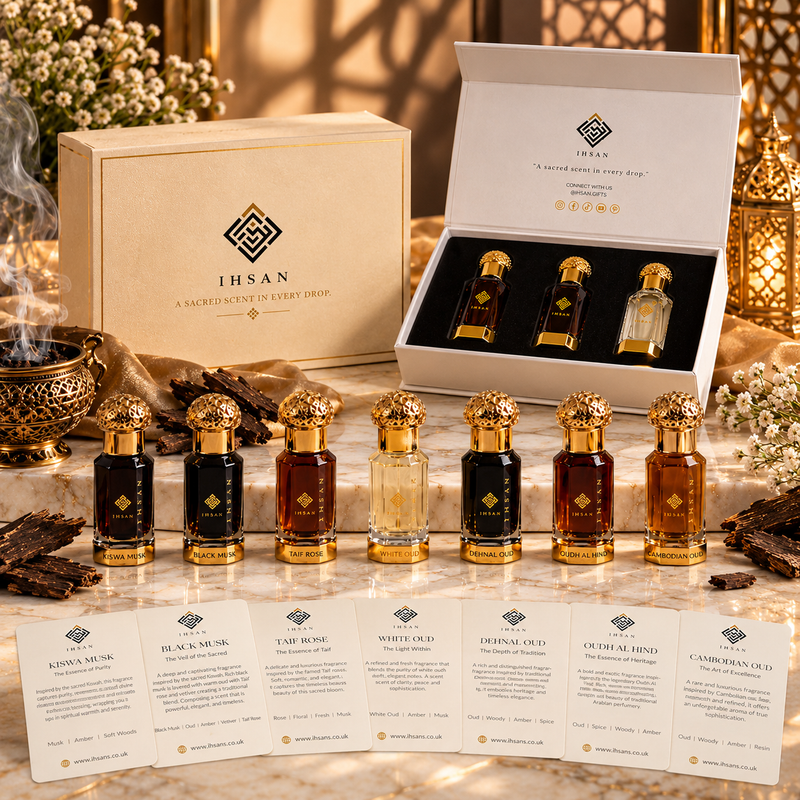 IHSAN luxury perfume oil collection featuring seven 3ml Arabian attar bottles with gold caps, premium gift boxes and an open three-piece perfume gift set on cream marble.